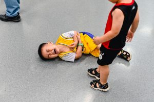 kid-bullied-on-the-floor