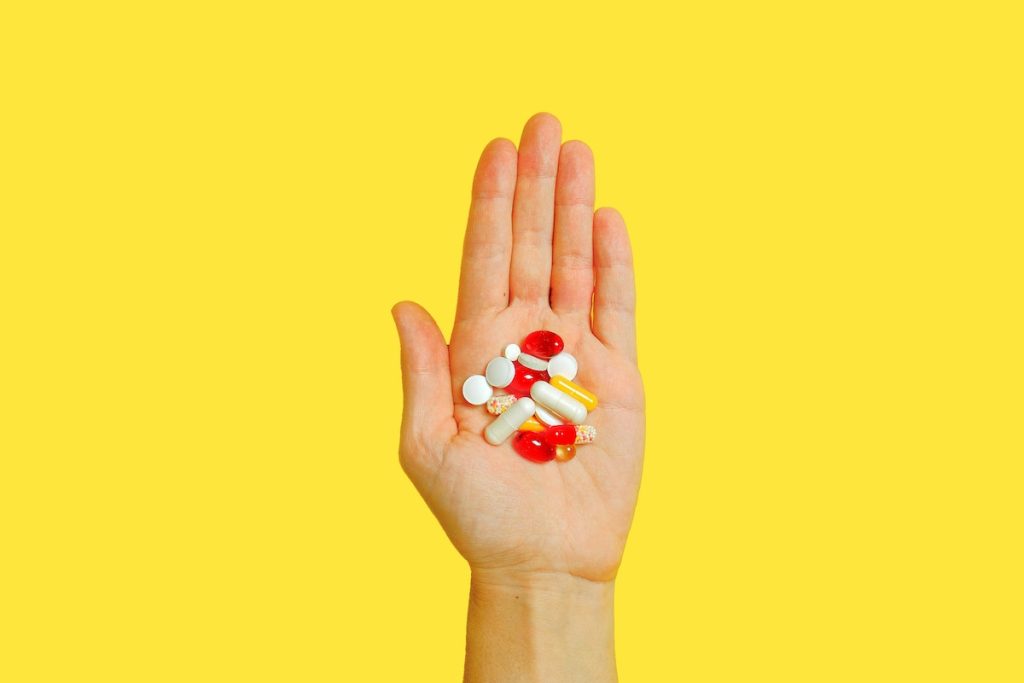 vitamins in the palm of a hand