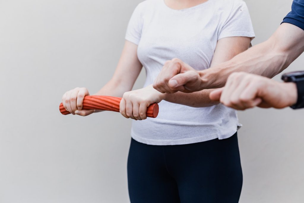 woman doing physical therapy for hand