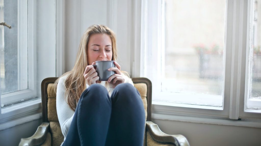 Woman Holding Gray Ceramic Mug