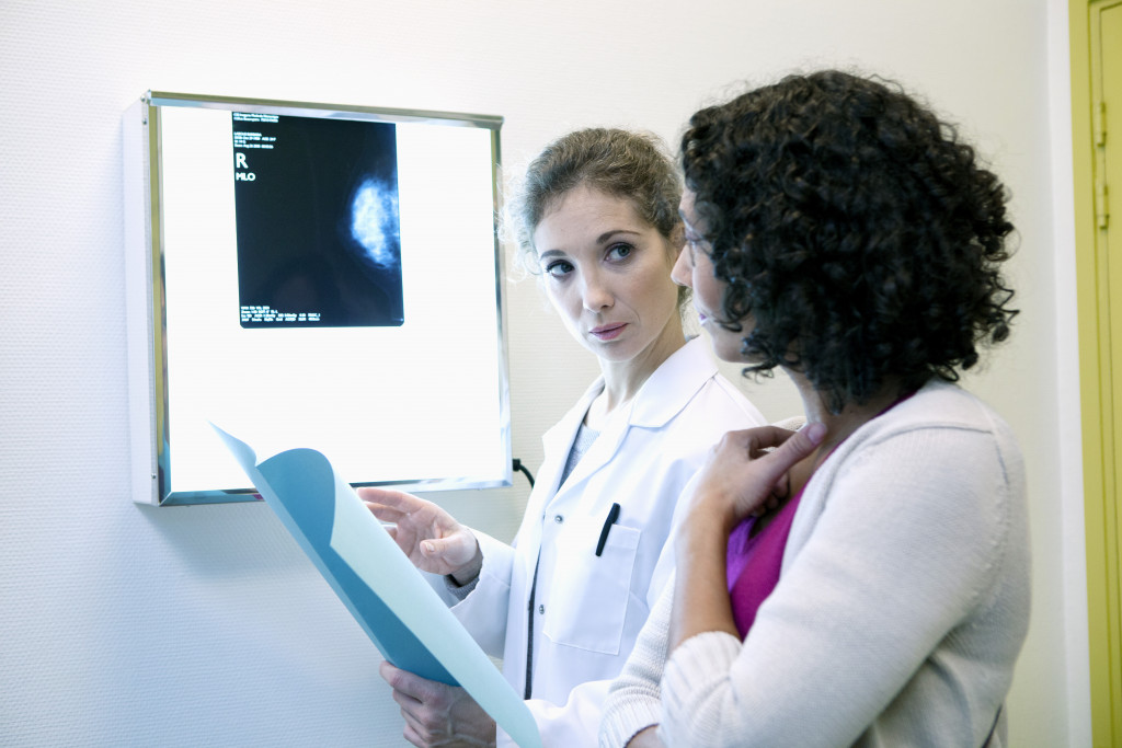 a doctor providing result of a mammography
