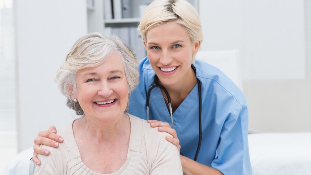 a female nurse with her elderly patient