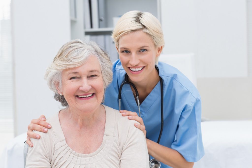 a female nurse with her elderly patient