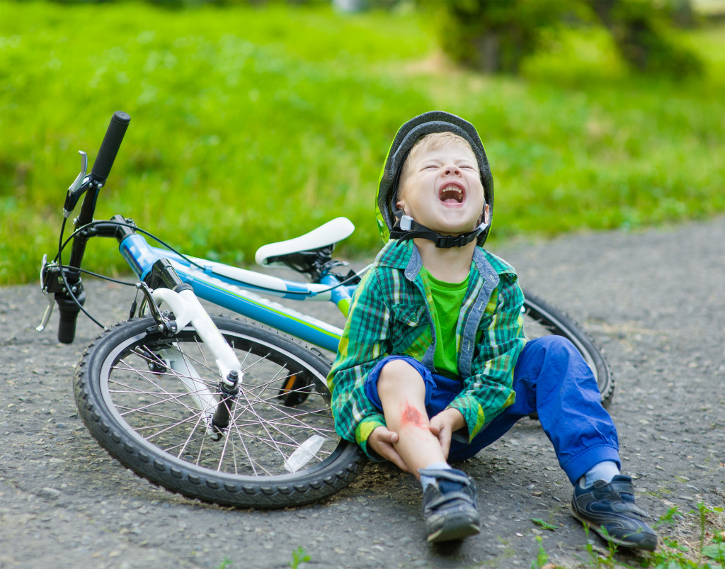 little boy crying after a bike accident